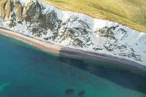 Best Aerial Footage of Gorgeous British Tourist Attraction and Ocean Sea View of Durdle Door Beach of England UK. Captured with Drone's Camera on September 9th, 2023 photo