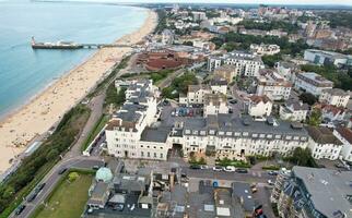 Ariel Footage of Attractive Tourist Destination at Bournemouth City Sandy Beach and Ocean of England Great Britain, Aerial Footage Captured with Drone's Camera on August 23rd, 2023 During sunny Day. photo