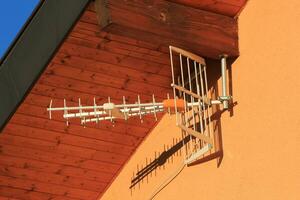 Antenna on house wall photo