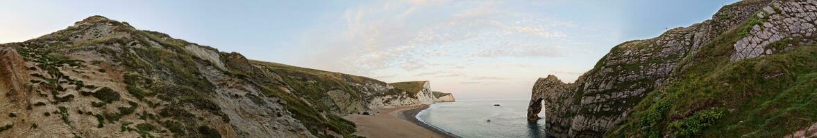 Most Beautiful High Angle View of British Landscape and Sea View of Durdle Door Beach of England Great Britain, UK. Image Was captured with Drone's camera on September 9th, 2023 photo