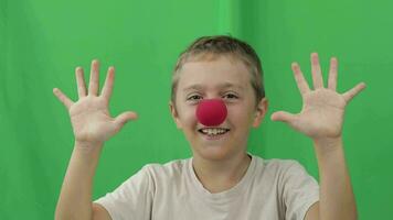 a happy boy with a red nose with green screen video