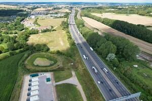 High Angle View of British Motorways and Highways and Traffic on M1 Junction 11a of Luton and Dunstable England UK. Image Was Captured on August 15th, 2023 photo