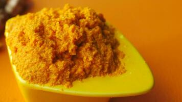 turmeric root and paste in a bowl on white background video