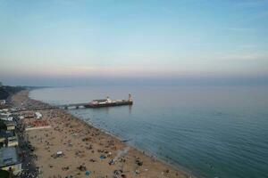 Beautiful Aerial Footage of British Tourist Attraction at Sea View of Bournemouth City of England Great Britain UK. High Angle Image Captured with Drone's Camera on September 9th, 2023 During Sunset photo