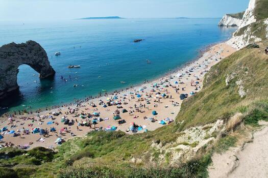 Most Beautiful High Angle View of British Landscape and Sea View of Durdle Door Beach of England Great Britain, UK. Image Was captured with Drone's camera on September 9th, 2023 photo