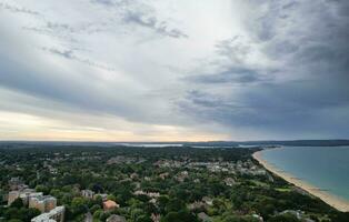 Aerial View of Most Beautiful and Attractive Tourist Destination at Bournemouth City Sandy Beach of England Great Britain, Image Was Captured with Drone's Camera on August 23rd, 2023 During sunny Day. photo