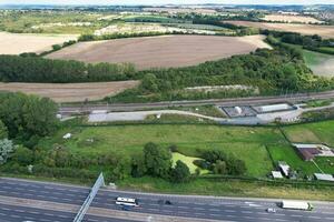 High Angle View of British Motorways and Highways and Traffic on M1 Junction 11a of Luton and Dunstable England UK. Image Was Captured on August 15th, 2023 photo