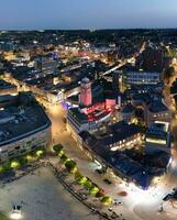 Aerial Vertical Panoramic View of Illuminated Downtown Buildings, Roads and Central Luton City of England UK at Beginning of Clear Weather's Night of September 5th, 2023 photo