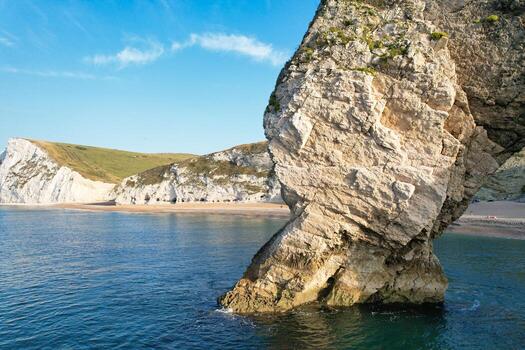 Most Beautiful View of British Landscape and Sea View of Durdle Door Beach of England Great Britain, UK. Image Was captured with Drone's camera on September 9th, 2023 photo