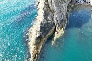 Most Beautiful View of British Landscape and Sea View of Durdle Door Beach of England Great Britain, UK. Image Was captured with Drone's camera on September 9th, 2023 photo