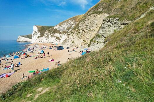 Most Beautiful High Angle View of British Landscape and Sea View of Durdle Door Beach of England Great Britain, UK. Image Was captured with Drone's camera on September 9th, 2023 photo
