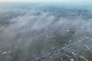 Most Beautiful and Best High Angle Dramatical Colourful Sky Footage from Above The Clouds. The Fast Moving Clouds During Sun rising Early in the Morning over Luton City of England UK photo