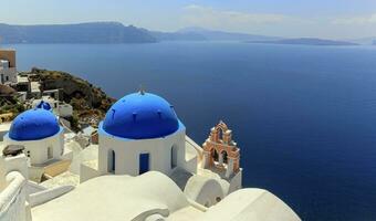 Church domes in Oia, Santorini, Greece photo