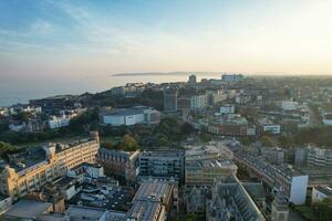 Aerial View of British Tourist Attraction of Bournemouth Beach and Sea view City of England Great Britain UK. Image Captured with Drone's Camera on September 9th, 2023 During Sunset photo