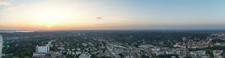Aerial Panoramic View of British Tourist Attraction at Sea View of Bournemouth City of England Great Britain UK. High Angle Image Captured with Drone's Camera on September 9th, 2023 During Sunset photo