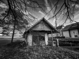 Spooky cottage in black and white photo