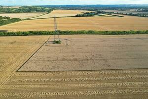 High Angle Panoramic Landscape View of British Agricultural Farms at Countryside Landscape of Sharpenhoe Clappers, Luton City of England UK. Footage Captured on August 19th, 2023 photo