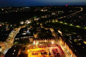 Aerial View of Illuminated Downtown Buildings, Roads and Central Luton City of England UK at Beginning of Clear Weather Night of September 5th, 2023 photo