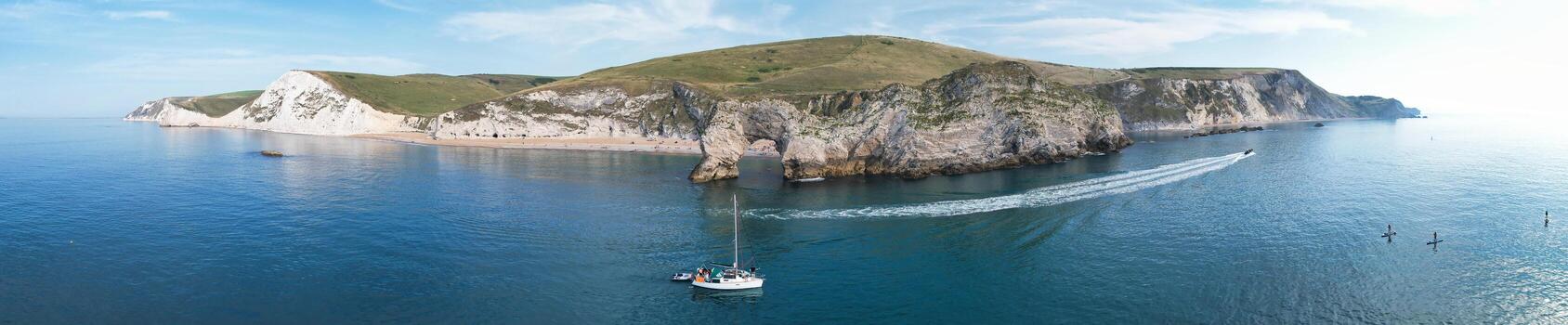 Most Beautiful High Angle View of British Landscape and Sea View of Durdle Door Beach of England Great Britain, UK. Image Was captured with Drone's camera on September 9th, 2023 photo