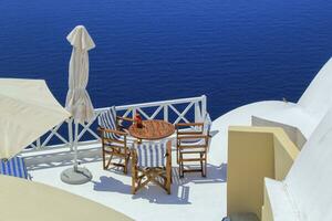 View from a balcony at Oia village in the Caldera, Greece photo