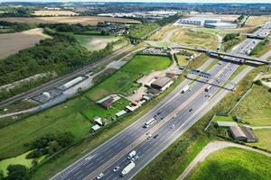 High Angle View of British Motorways and Highways and Traffic on M1 Junction 11a of Luton and Dunstable England UK. Image Was Captured on August 15th, 2023 photo
