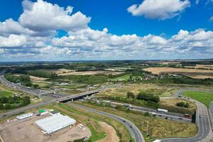 High Angle View of British Motorways and Highways and Traffic on M1 Junction 11a of Luton and Dunstable England UK. Image Was Captured on August 15th, 2023 photo