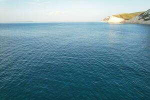 Most Beautiful View of British Landscape and Sea View of Durdle Door Beach of England Great Britain, UK. Image Was captured with Drone's camera on September 9th, 2023 photo