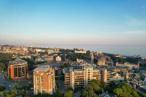 Aerial View of British Tourist Attraction of Bournemouth Beach and Sea view City of England Great Britain UK. Image Captured with Drone's Camera on September 9th, 2023 During Sunset photo