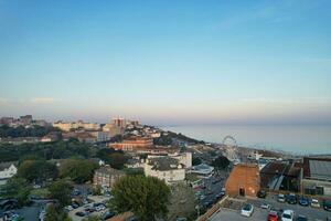 Aerial View of British Tourist Attraction of Bournemouth Beach and Sea view City of England Great Britain UK. Image Captured with Drone's Camera on September 9th, 2023 During Sunset photo