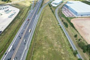 High Angle View of British Motorways and Highways and Traffic on M1 Junction 11a of Luton and Dunstable England UK. Image Was Captured on August 15th, 2023 photo