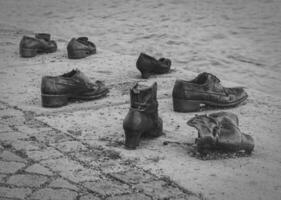 Iron shoes memorial to Jewish people executed WW2 in Budapest, Hungary photo