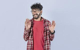 Person with denial expression moving hands. Man with denial expression, man awkwardly refusing photo