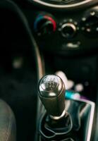 Close-up of a car gear stick manual transmission, Manual gear lever of a car. View of a car gear stick manual transmission. photo