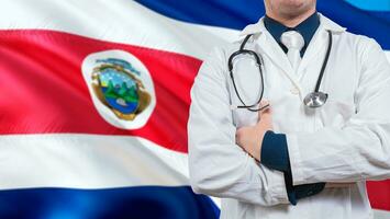 Doctor with stethoscope on Costa Rica flag. Costa Rica national health concept, Health and care with flag of Costa Rica photo