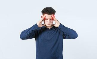 Concept of a man with a headache, man rubbing his head on isolated background, guy giving himself a head massage, concept of a man with a migraine photo