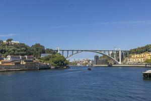 Image of the bridge Ponte da Arrabida over the Douro river near Porto photo