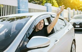 Angry driver yelling at another driver. Driver man yelling at driver while driving, Impatient driver yelling. Shouting impatient driver concept photo