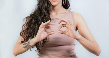 Interpreter gesturing in sign language. People gesturing in sign language isolated. Unrecognizable woman gesturing in sign language photo