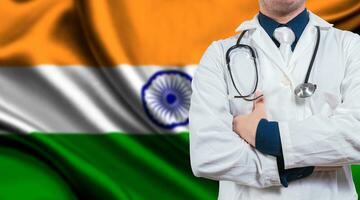 Doctor with stethoscope on India flag. Doctor with arms crossed on India flag background. Medical health and care on Indian flag photo