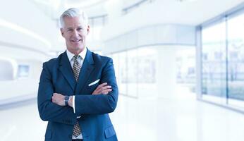 Senior businessman in his office photo