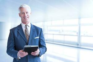 Senior businessman in his office photo