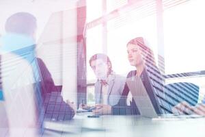 Business Team At A Meeting at modern office building photo