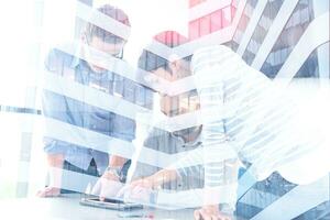 group of Business People Working With Tablet in startup office photo