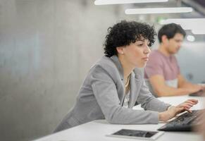 female software developer using desktop computer photo