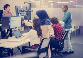 multiethnics team of software developers working together photo