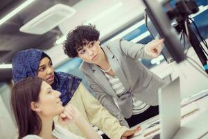 multiethnics team of software developers working together photo
