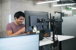 young multiethnics team of software developers working together photo