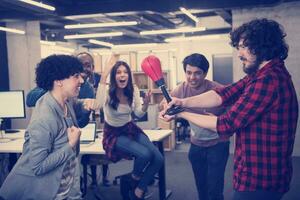 multiethnics business team boxing at office photo