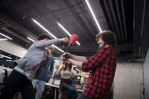 multiethnics business team boxing at office photo