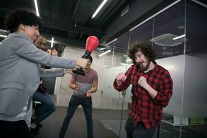 multiethnics business team boxing at office photo